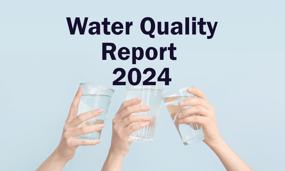 Smiling woman holds a glass of water. Text overlay reads &quot;Water Quality Report 2023&quot;